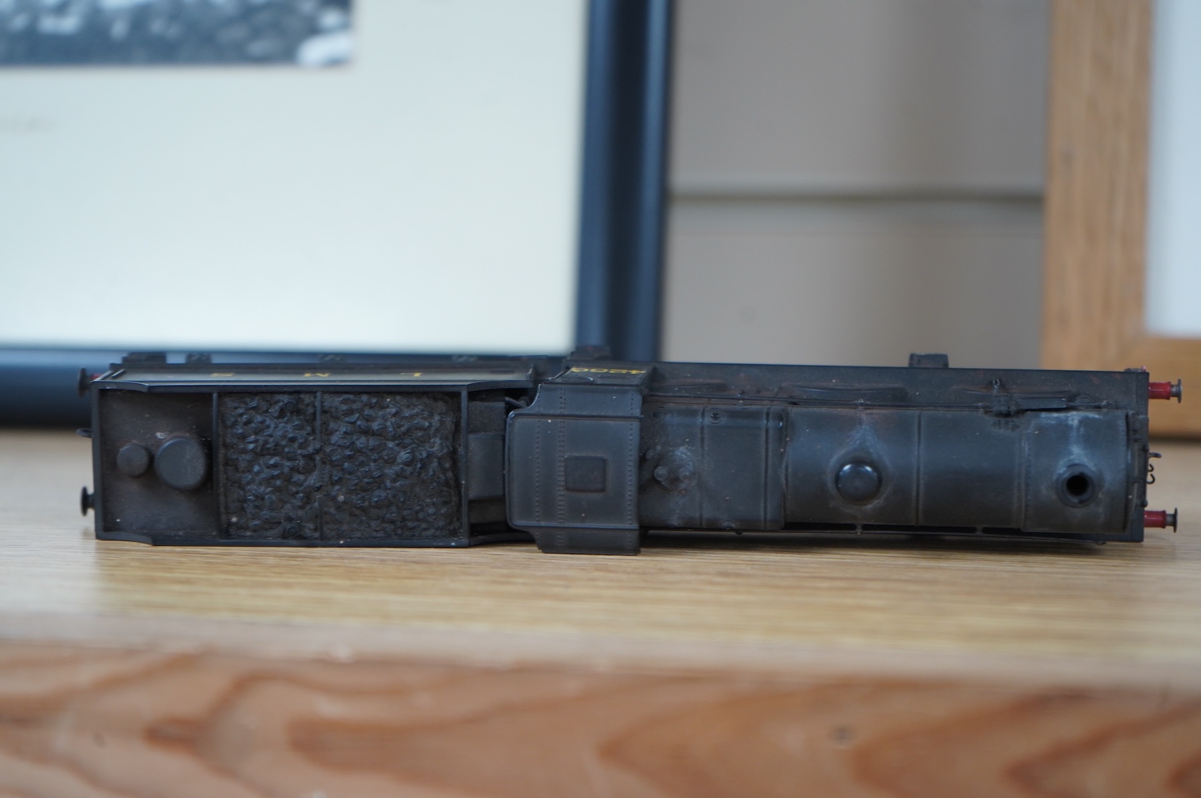 Two kit built and adapted EM gauge LMS railway locomotives; an 0-8-0, 9518, and an 0-6-0 class 4F based on an Airfix kit, together with the body only of an SR Schools Class